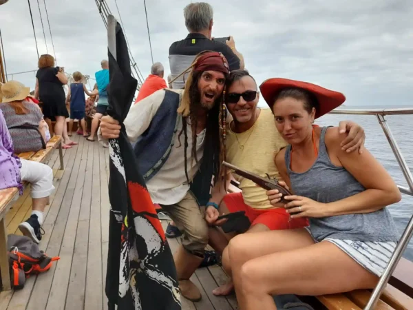 pirate playing with a couple aboard the Peter Pan ship