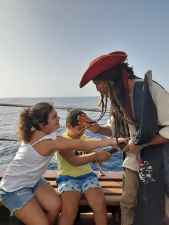 Pirate playing with children on board