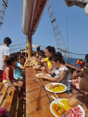 Children eating lunch aboard the Peter Pan